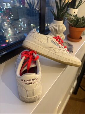 Reebok “IT’S A MAN’S WORLD” White Leather Sneakers with colored laces